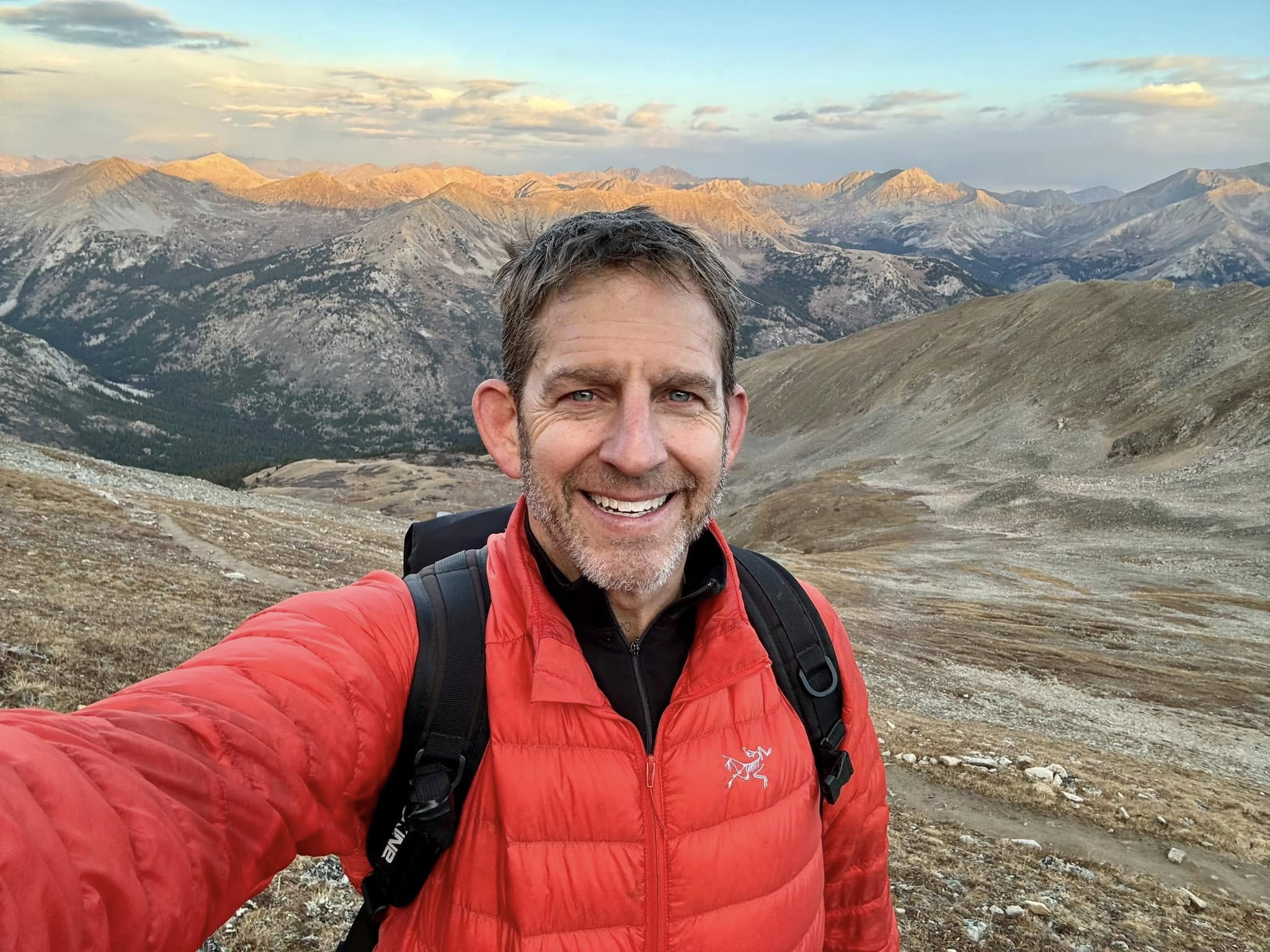Rick Janson in a mountain landscape, representing vision and strategy.